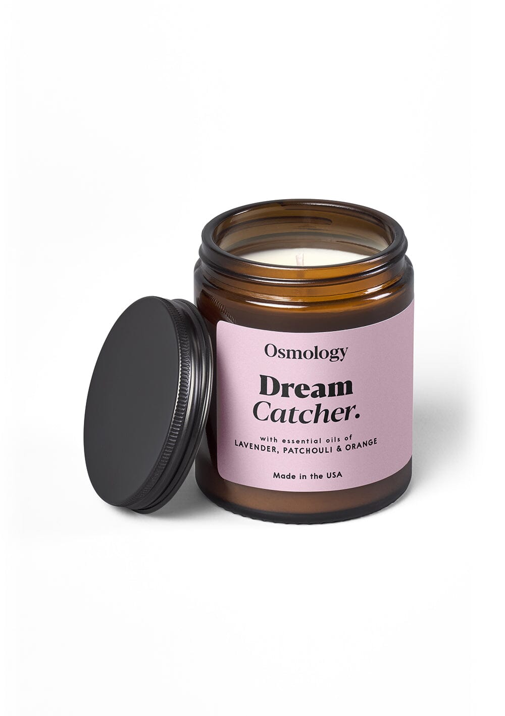 Osmology Dream Catcher jar candle with black lid on white background