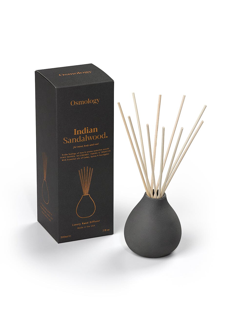 Osmology black ceramic Indian Sandalwood reed diffuser next to product packaging on a white background