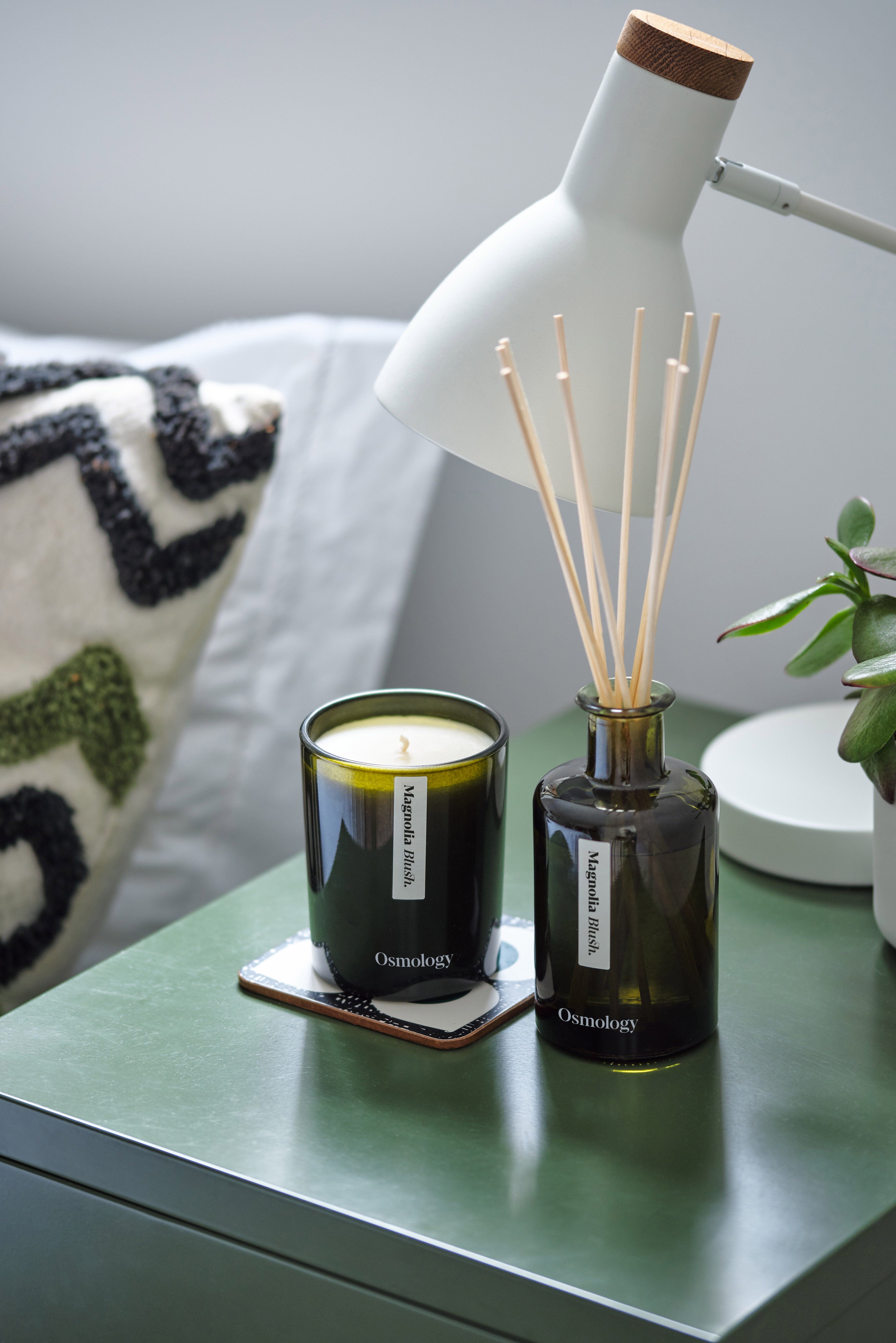 Magnolia Blush Candle by Aery with diffuser sat on bedside table 